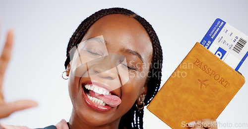 Image of Selfie, face or happy black woman with a passport in studio for holiday travel or post vacation trip online. Grey background, social media or African tourist with ticket or tongue out in celebration