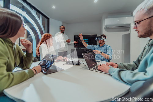 Image of A diverse group of businessmen collaborates and tests a new virtual reality technology, wearing virtual glasses, showcasing innovation and creativity in their futuristic workspace