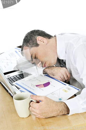 Image of Businessman asleep at his desk on white background