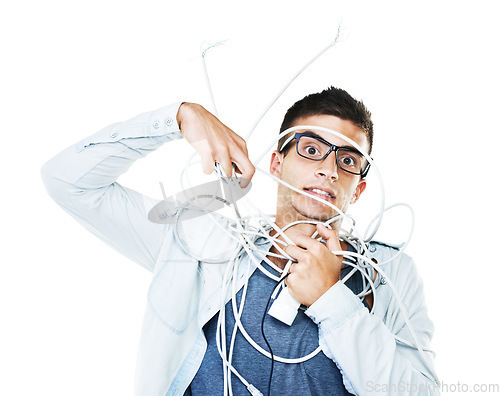 Image of Portrait of man in glasses tangled in wire, cables and isolated on a white background. Face of serious geek wrapped in cord and tech of nerd or electrician, mistake and problem, chaos or struggle