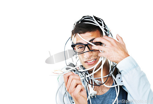 Image of Portrait of man in glasses tangled in cables, wire and isolated on white background. Face of serious geek with cord, wiring and technology of nerd or electrician, mistake and problem on mockup space