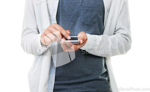 Image of Hands, man and typing with phone in studio, scroll social media and reading notification on white background. Closeup, model and download app for mobile games, search online and digital subscription