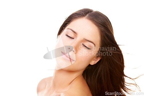 Image of Woman, face or eyes closed with smile in studio for hair care, keratin treatment and healthy texture. Person, beauty or skincare with confidence, facial glow or shine and cosmetic on white background