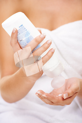 Image of Woman, skincare and hands with cream, sunscreen and lotion for dermatology and self care in bathroom. Shower, product and person with bottle of moisturiser for body, beauty and healthy skin routine