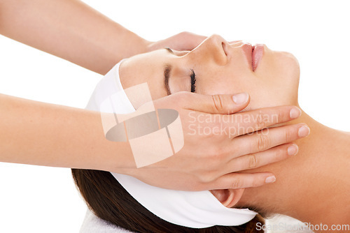 Image of Face, hands and facial massage with a woman customer in studio isolated on a white background for stress relief. Spa, luxury treatment and a young person at the salon for health, wellness or to relax