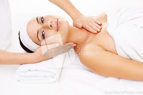 Image of Portrait, massage and smile with a woman customer at the spa from above to relax during luxury treatment. Face, hands and salon with a young person on a table for wellness, hospitality or therapy