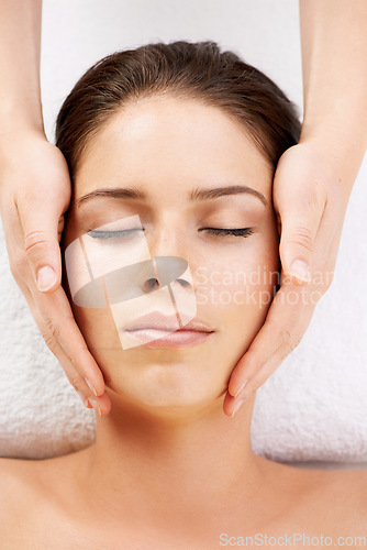 Image of Spa, massage and hands on face of woman from above at a resort for stress relief, pamper or treatment. Top view, facial and female with masseuse at a beauty salon for luxury, skincare or dermatology