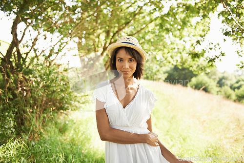 Image of Portrait, freedom or woman in an outdoor field in the countryside in spring to relax on break. Nature, wellness or biracial female person in garden or farm for fresh air on holiday vacation or travel