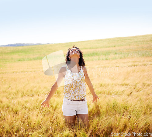 Image of Breathing, freedom or happy woman in a field in the countryside in spring to relax on break. Smile, wellness or female person in farm for fresh air on holiday vacation, gratitude or travel in nature