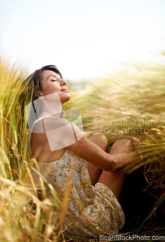 Image of Relax, summer or calm woman in a field, countryside or outdoor garden for freedom in park or nature. Zen, wellness or female person in farm to breathe in fresh air on holiday vacation or travel