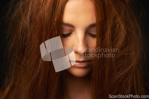 Image of Depression, thinking or sad woman in studio with trauma stress, fail or bad results alone. Black background, psychology or face of a lonely female person with anger, messy hair or moody attitude