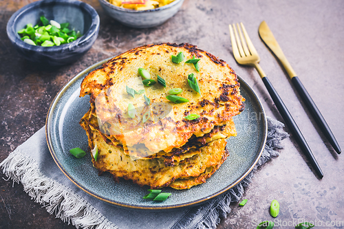 Image of Homemade hash browns or potato pancake with cabbage salad and green onions