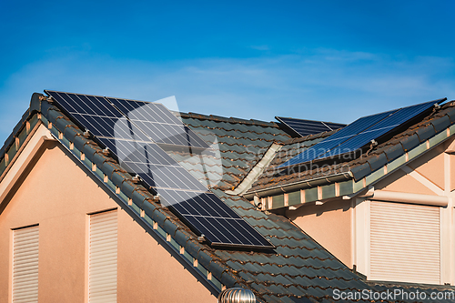 Image of Photovoltaic panels on the roof of family house, solar panels. 