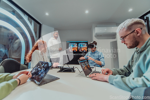 Image of A diverse group of businessmen collaborates and tests a new virtual reality technology, wearing virtual glasses, showcasing innovation and creativity in their futuristic workspace