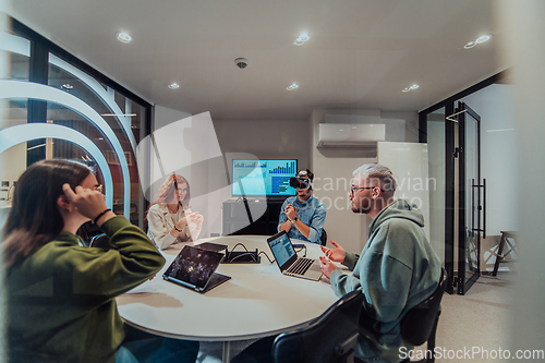 Image of A diverse group of businessmen collaborates and tests a new virtual reality technology, wearing virtual glasses, showcasing innovation and creativity in their futuristic workspace