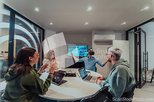 Image of A diverse group of businessmen collaborates and tests a new virtual reality technology, wearing virtual glasses, showcasing innovation and creativity in their futuristic workspace