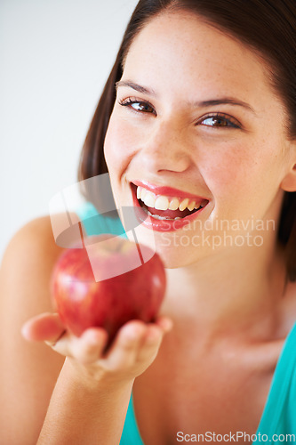 Image of Health, happy and portrait of woman with apple for nutrition, wellness and snack in studio. Food, balance diet and face of person with fruit for vitamins, detox and lose weight on white background