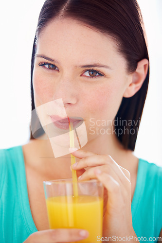 Image of Health, drink and portrait of woman with juice for nutrition, wellness and hydration in studio. Happy, thirsty and face of person with fruit blend for vitamins, detox and diet on white background