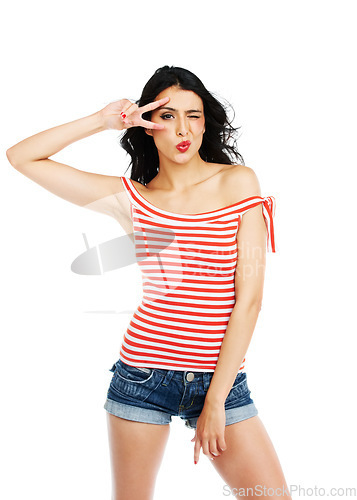 Image of Fashion, wink and woman face with peace, hands or kiss gesture in studio on white background. V, sign and portrait of lady model with trendy, outfit or thank you, cool or good vibes, emoji or mood