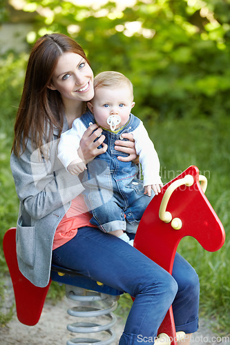 Image of Portrait, mother and baby with toy, horse and park for fun in bond by playing for outside together. Happy woman, infant or smile for milestone, future growth or development with love, support or care