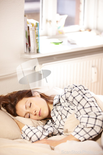 Image of Woman, sleeping and bed in home for relaxing, dream or nap for tiredness with peace in morning. Girl, resting or fatigue for exhausted on pillow for wellness, health or care of wellbeing on mattress