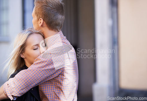 Image of Love, city and couple hug in street for date, cute relationship and bonding outdoors on weekend. Dating, romance and happy man and woman embrace for flirting, connection and affection in urban town