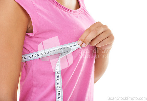 Image of Chest, measure tape and hand of woman for wellness, breast augmentation and plastic surgery in studio mockup. Model, cosmetic and boobs beauty for silicone implants, healthcare and white background