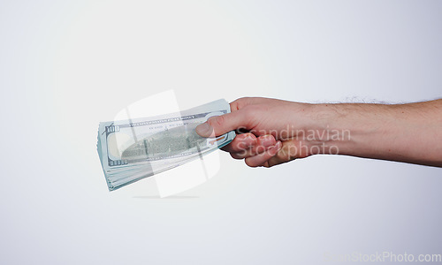 Image of Hand, payment and closeup of money in a studio for retail shopping, paying bills or debt. Mockup, paper cash and zoom of person with dollar bank notes for buying products isolated by white background