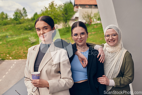 Image of A group of professional businesswomen taking a break, sipping coffee and engaging in discussions, fostering a sense of empowerment and collaboration in the modern workplace.