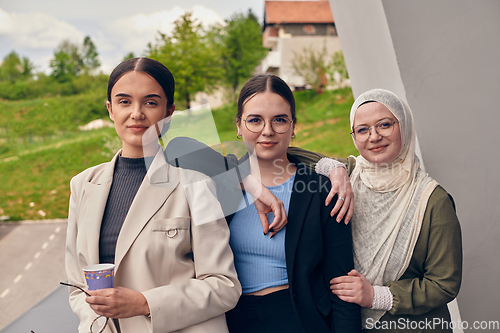 Image of A group of professional businesswomen taking a break, sipping coffee and engaging in discussions, fostering a sense of empowerment and collaboration in the modern workplace.