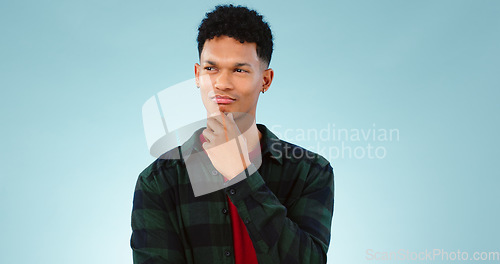 Image of Thinking, confused and man doubt decision in studio isolated on a blue background mockup space. Solution, idea and person with question, contemplating and problem solving, planning choice or remember