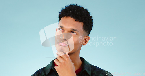 Image of Thinking, confused and man doubt choice in studio isolated on a blue background mockup space. Solution, idea and person with question, contemplating or problem solving, planning decision or remember