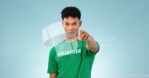 Image of Portrait, man and pointing at you for volunteer in studio for climate change mockup on blue background in Cape Town. Young, male model and talking for support, decision and eco friendly for future