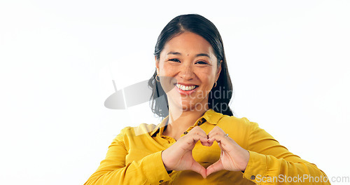 Image of Portrait, love and heart hands with a young asian woman isolated on a white background in studio for health or wellness. Face, romance and satisfaction with a happy young person on valentines day