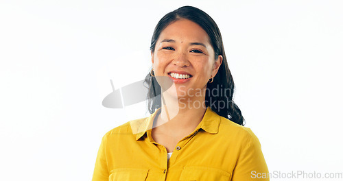 Image of Portrait, smile and a young asian woman isolated on a white background in studio looking confident or positive. Face, happy and satisfaction with a korean girl in a casual clothes outfit for fashion
