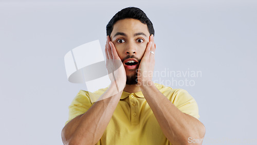 Image of Portrait, man and surprise with announcement, news and expression on a white studio background. Face, person or model with emoji, shocked or omg with gossip, wow or reaction with mockup space or info