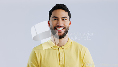 Image of Man, portrait and smile in studio with fashion, casual style and confidence on white background with mock up space. Person, face and happiness, pride and joyful expression with cool outfit or clothes