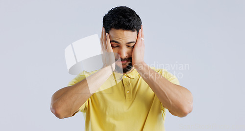 Image of Stress, anxiety and a young asian man in studio isolated on a white background for mental health. Burnout, headache and the hands of a sad person on his face in frustration for worry or a mistake