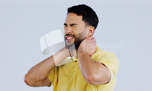 Image of Neck pain, stress and man in studio with tired joints, arthritis risk and burnout on white background. Sick indian model, injury and massage muscle for first aid, emergency or frustrated with fatigue