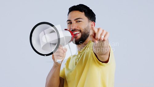 Image of Man, megaphone and studio portrait to point at you for choice, recruitment or announcement by background. Speaker, protest or call to action for accountability with speech, sound or noise on bullhorn