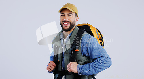Image of Happy man, portrait and backpack on mockup for hiking, adventure or travel against a studio background. Male person, model or hiker smile with bag for trekking journey, exercise or outdoor fitness