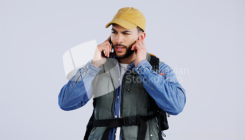 Image of Hiking, man and phone call service, frustrated and studio isolated on a white background mockup space. Person trekking, mobile and lost connection signal, confused and backpacker in communication