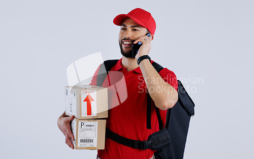 Image of Courier man, phone call and box in studio with contact for location, direction and supply chain by background. Logistics expert, smartphone and backpack with cardboard package, product and thinking