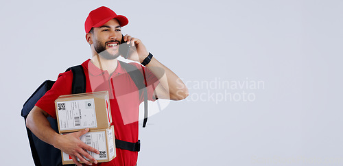 Image of Delivery man, phone call and box in studio, space and mockup in talk for location, info or supply chain by background. Courier, smartphone and backpack with cardboard package, product and promotion