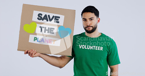 Image of Volunteer man, poster and studio portrait to save the planet in global warming, crisis or ecology by background. Person, social responsibility and cardboard sign for sustainability for climate change