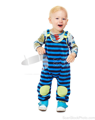 Image of Baby, boy and toddler in studio with fashion, style and grow with curiosity, happiness and excited for kindergarten. Child, smile and standing in white background in jumpsuit, outfit and clothes