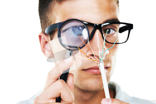 Image of Electrician, cables and portrait of man with test, analysis and check with magnifying glass in white background. Studio, technician or working with electricity, wires or search for solution and power