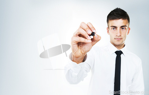 Image of Pen, ideas and hand of businessman writing in studio, white background and invisible whiteboard. Man, planning and notes for strategy, problem solving and working with inspiration mockup space