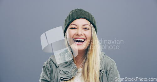Image of Face, fashion or happy woman in studio laughing at joke or crazy comedy isolated on gray background. Funny, model or cool female person with freedom, silly smile or joy to relax alone with humor