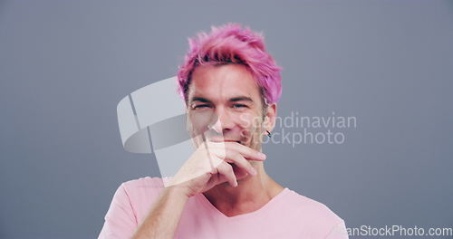 Image of Face, crazy or happy man in studio laughing at joke or comedy alone isolated on gray background. Cool guy, proud model or silly male person with a funny smile, joy or pink hair to relax with humor